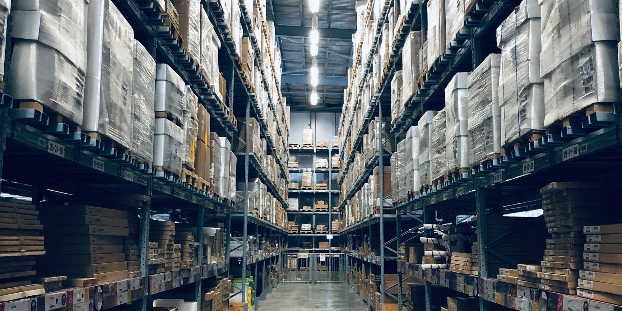 Warehouse stocked with pallets of gloves ready for bulk orders