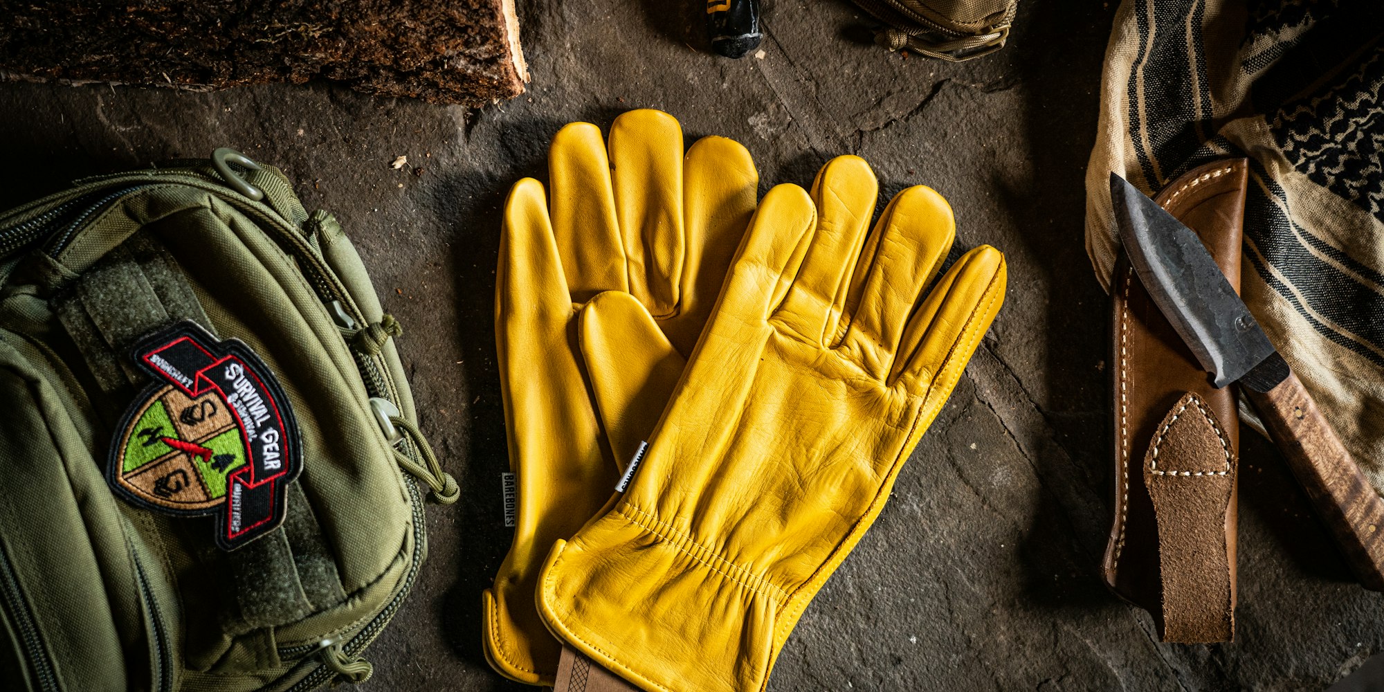Premium leather work gloves laid out on a workbench